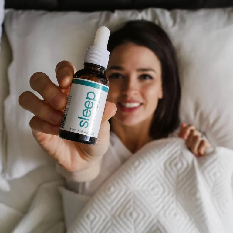 holding CBD tincture for sleep